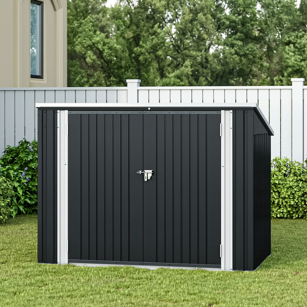 closed 6x4ft black garden bin storage shed blending seamlessly into backyard environment