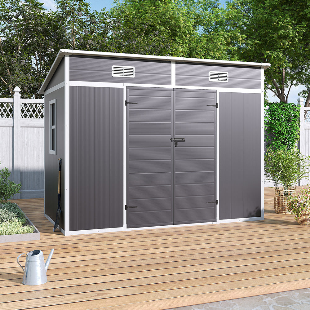 8x4ft grey outdoor plastic shed placed on patio against fence – ideal garden storage for limited spaces