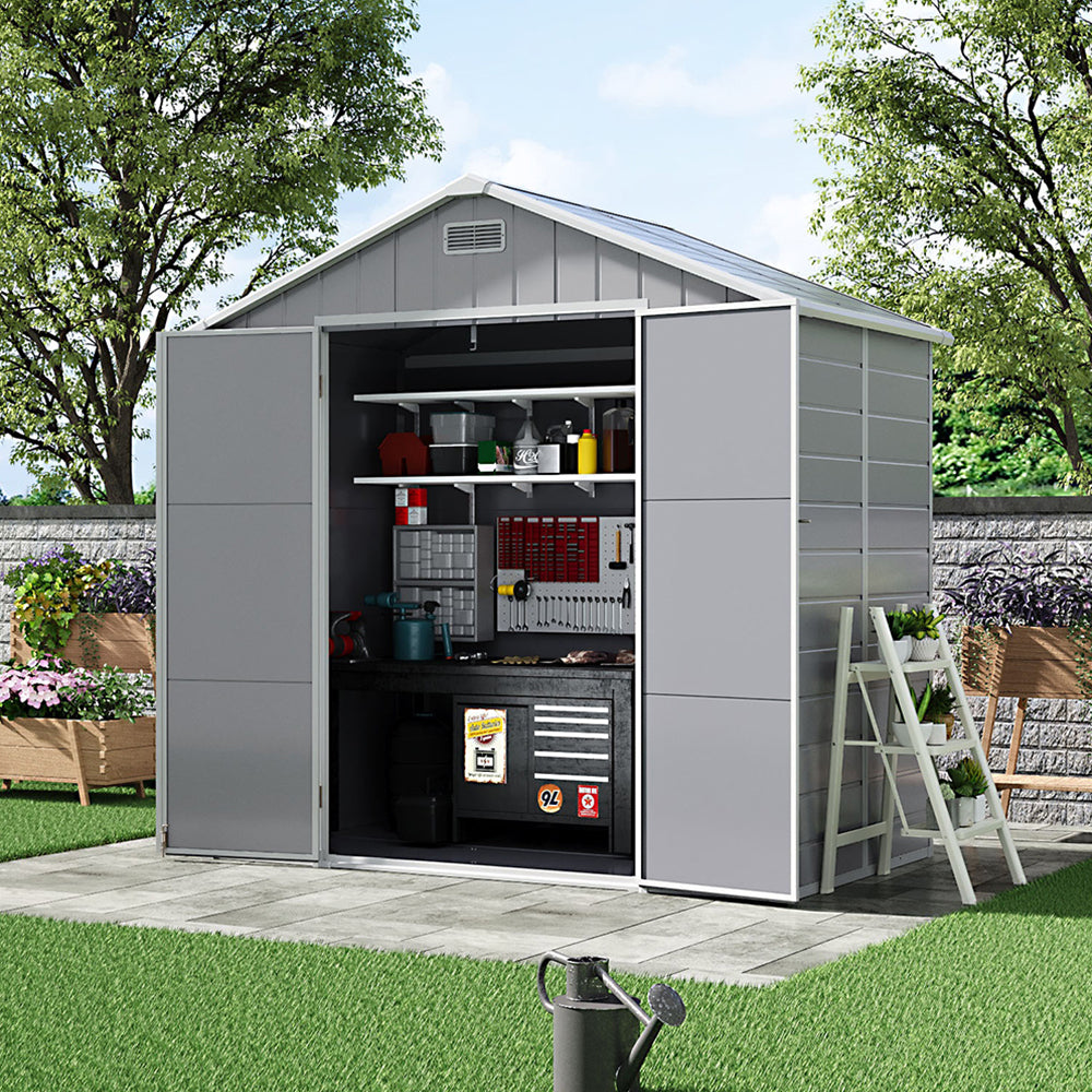 8x4ft plastic garden tool shed with open doors placed against backyard fence – ideal for storing rakes and lawn tools
