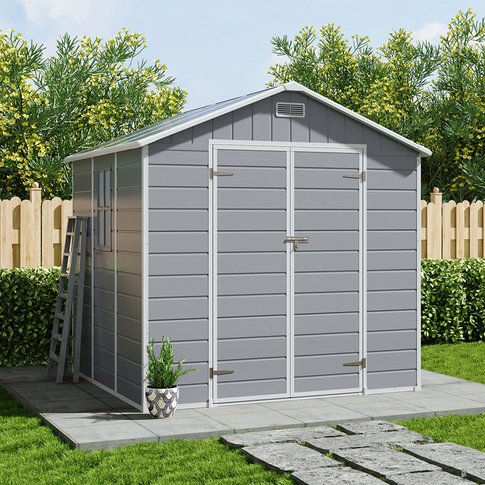 Closed 8x6ft grey garden tool shed positioned against fence – sleek and compact outdoor storage solution