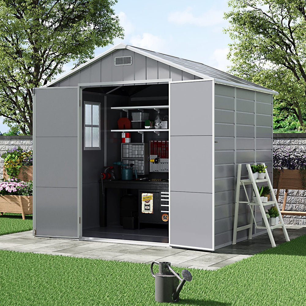 Angled view of 8x6ft plastic garden shed with window and open doors – bright interior with tool storage inside