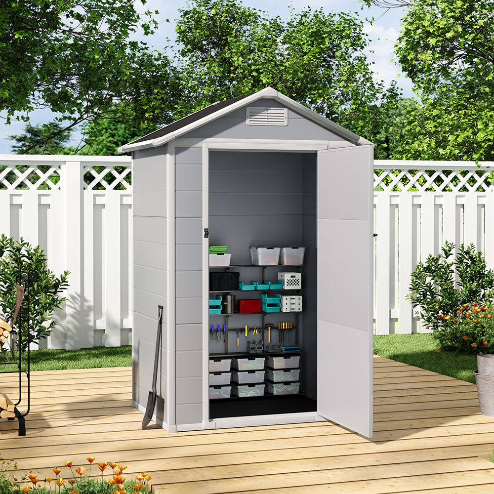 4x3ft outdoor garden shed with open door showing organized tool storage in backyard setting