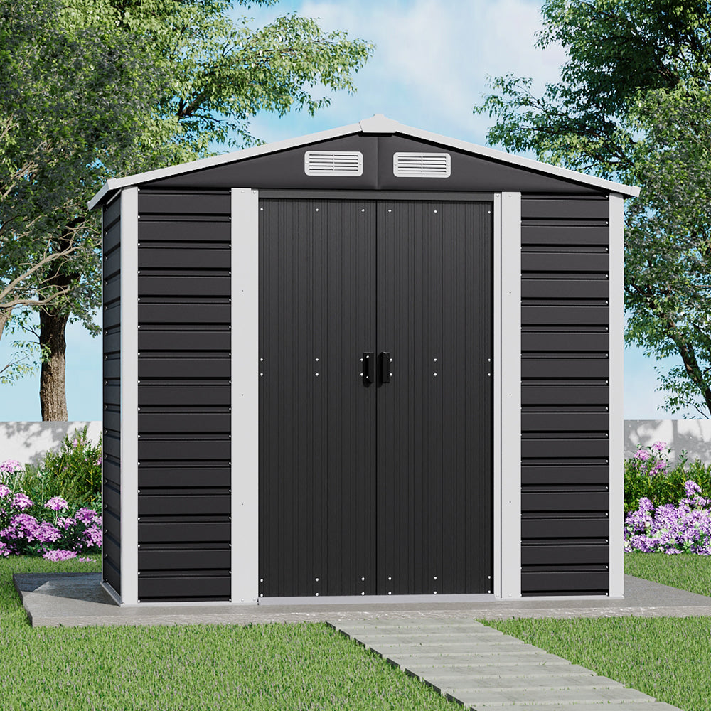 Charcoal black garden shed 7x4ft closed – modern outdoor storage unit placed in backyard setting