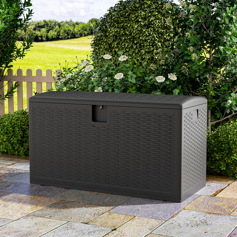 Closed black rattan storage box in patio setting – waterproof outdoor chest for garden items