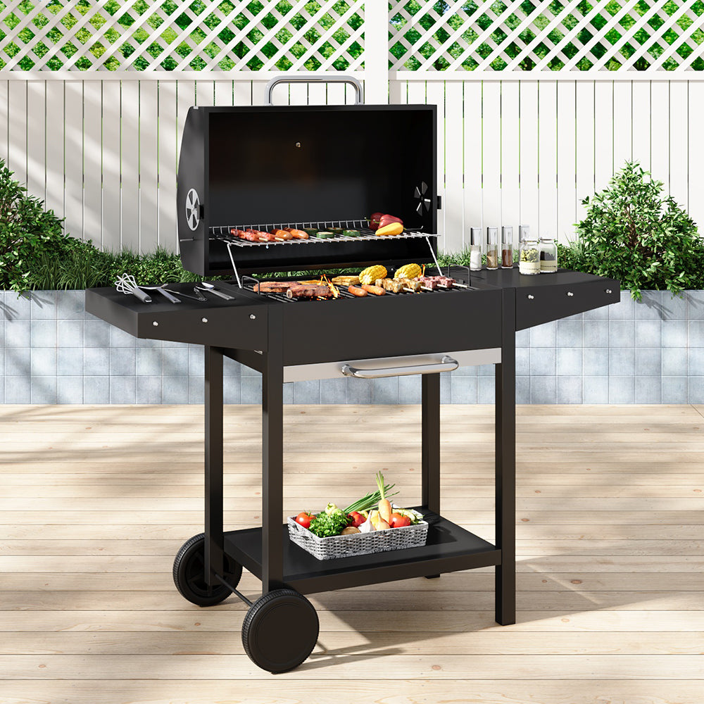 Outdoor Charcoal BBQ Grill with Dual Side Tables in Garden Patio Setup – Perfect for Summer Grilling